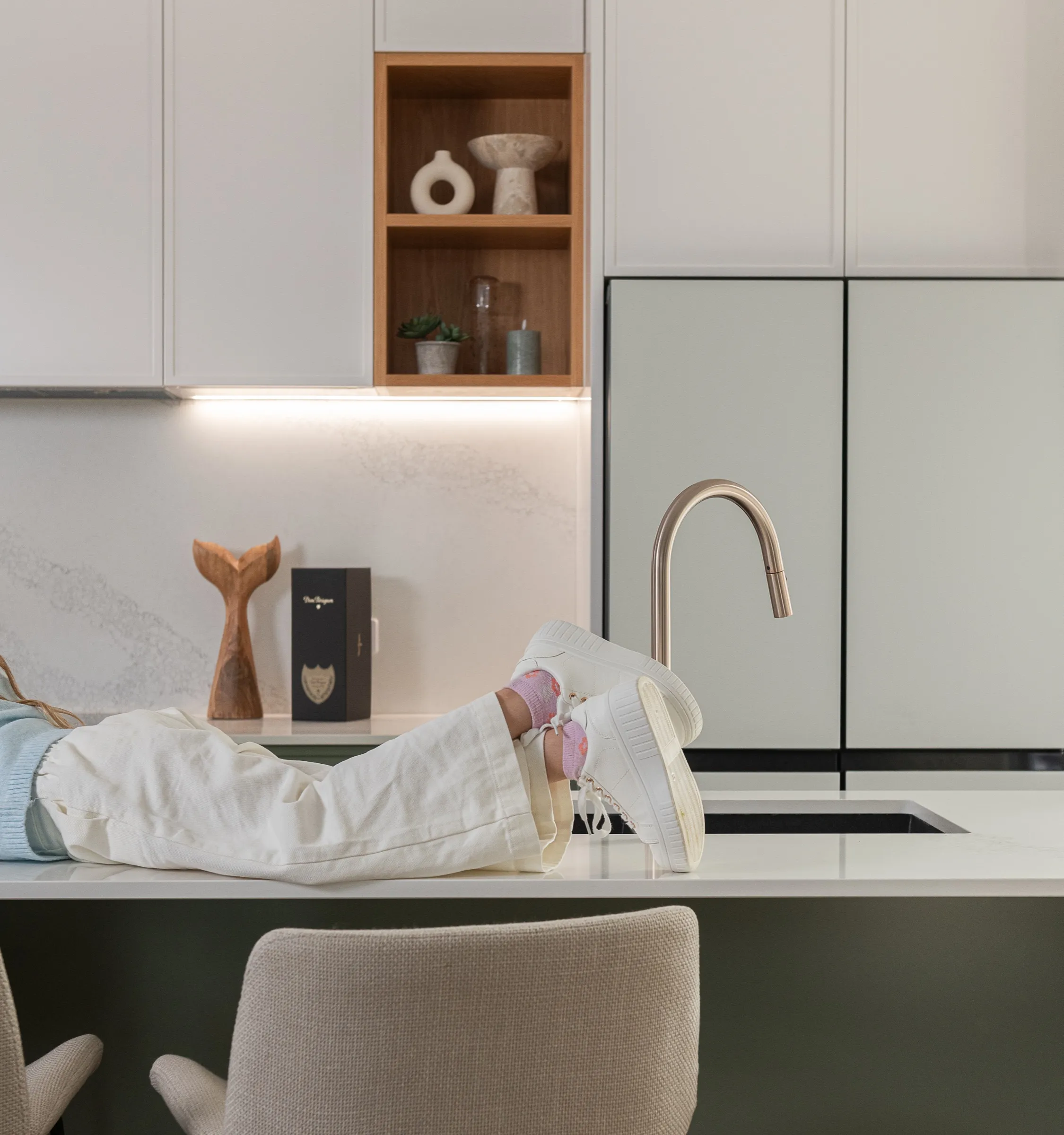 Child relaxing on a kitchen island